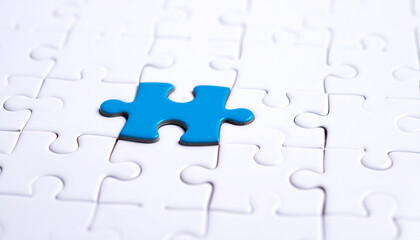 Blue jigsaw piece in position representing success, clarity, and strategic solution.