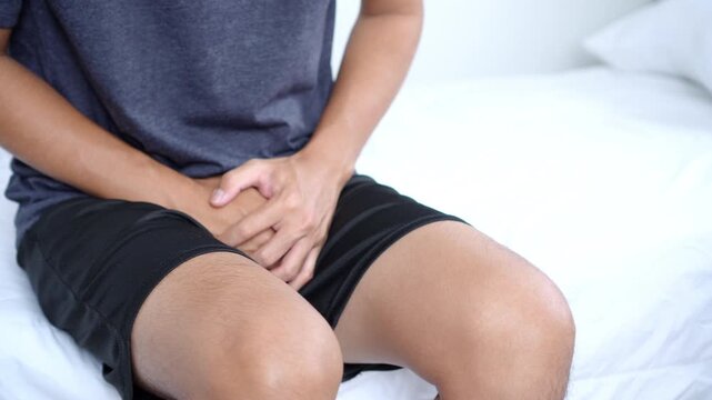 Asian man suffering from cystitis, urinary tract infection (UTI), and benign prostatic hyperplasia (BPH). He experiences painful urination, bladder discomfort, and urinary problems. 
