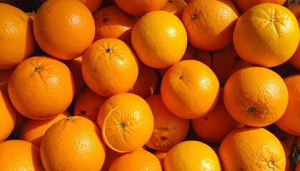 A close-up of many bright oranges