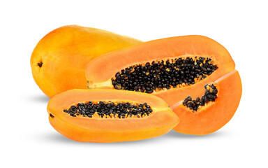 fresh ripe papayas, whole and halved, with seeds on a dark background