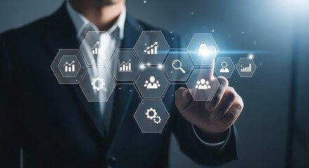 Businessman interacting with digital interface of business analytics and strategy icons technology
