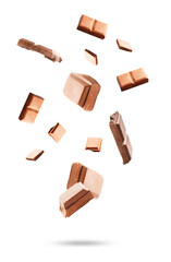dynamic array of falling chocolate pieces, captured in mid-air against a transparent background