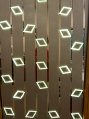 A wall with a pattern of diamonds and squares