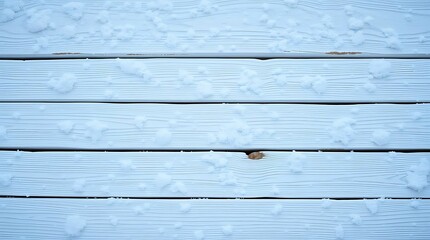 Naklejka premium Wooden planks covered with snow as background, top view. Winter season.