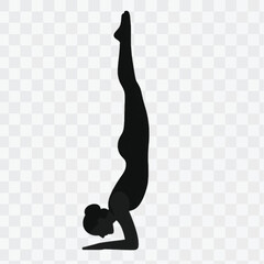 Silhouette of a Woman Practicing Yoga Headstand Pose.