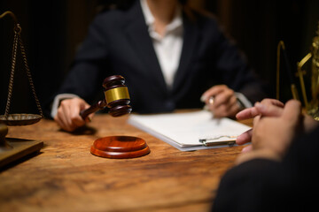 Judge holding gavel making verdict in law courtroom