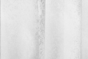 ざらざらの紙と、ぼやけたレースのカーテンの画像