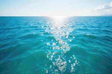 Fototapeta premium Vast, cerulean ocean stretching to the horizon, sunlight shimmering on the waves, a tranquil and serene seascape Perfect for travel, nature, and environmental themes , depth, current, spray