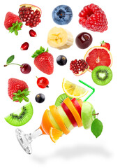 dynamic composition of various healthy fruits including a creative cocktail glass, scattered on black