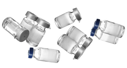 scattered empty medical glass vials with blue and grey caps for pharmaceutical use