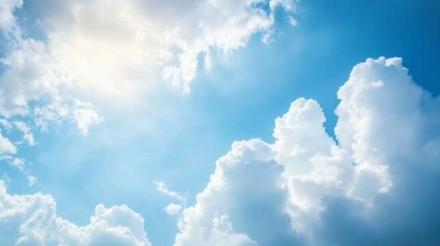 Abstract sunny day sky with fluffy clouds background, Subject silhouette on the right side, leaving copy space on the left for puter wallpaper.