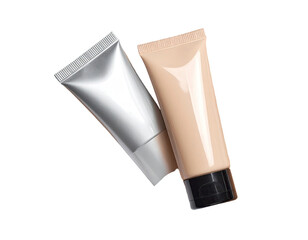 Two tubes of cosmetic product, one silver, one beige, overlapping