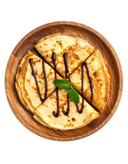 Crepes sliced, drizzled with chocolate, mint leaf, wooden plate