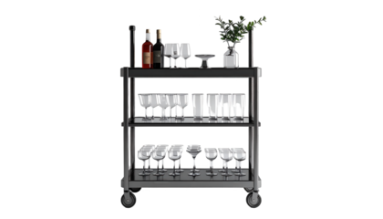 Display of glassware and bottles arranged on a multi-tiered serving cart, featuring wine bottles, elegant stemware, and decorative plant arrangements set against a black backdrop.