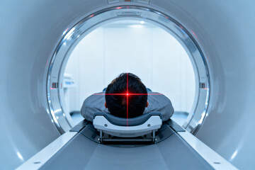 Patient undergoing MRI scan in a medical imaging machine