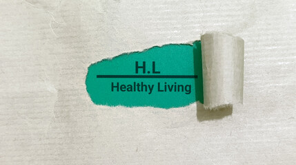 Healthy living concept revealed through torn paper showing a vibrant green message