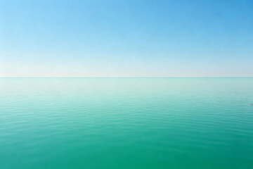 Calm turquoise ocean meeting a clear blue sky at the horizon