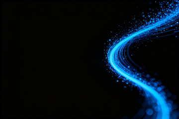 Abstract blue light trail with glowing particles on a dark background