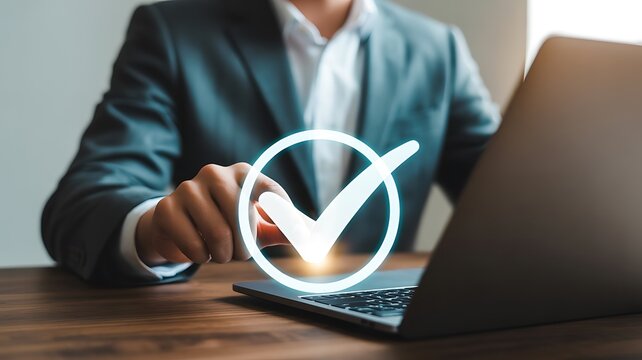 Businessman using laptop with check mark icon for task completion concept