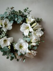 Elegant white amaryllis and fresh green eucalyptus leaves garland hanging on a plain neutral wall, minimalist holiday decoration concept, creating a peaceful and tranquil atmosphere