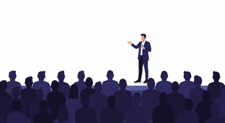Obraz premium A businessman in a suit stands on stage, giving a presentation to a large, silhouetted audience at a conference.
