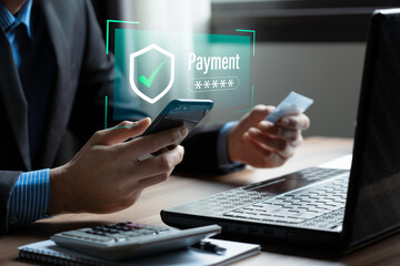 Secure online payment and financial technology concept with user using smartphone and laptop for safe transaction, digital wallet, mobile banking, ecommerce checkout, data protection, cybersecurity