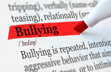 the definition of the word BULLYING highlighted in red
