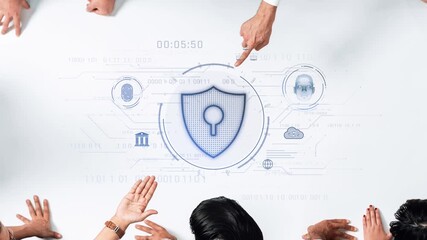 A diverse team engages in a cybersecurity strategy discussion, featuring a digital security shield and data visualization elements on a modern workspace table. Raster - Powered by Adobe