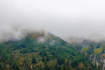 Fog on the mountains. Clouds descending on the peaks of the Fagaras Mountains