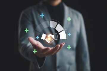 Business partnership,handshake agreement concept,man presenting glowing handshake icon,modern digital interface for trust,collaboration,teamwork and success in corporate strategy