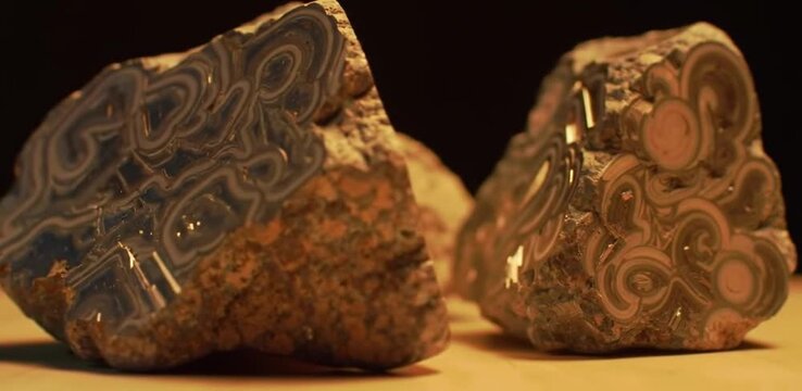 Polished minerals shimmer, revealing rare earth power, side-lit beauty