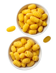 Two small white bowls filled with golden pasta spirals, with loose pasta pieces around