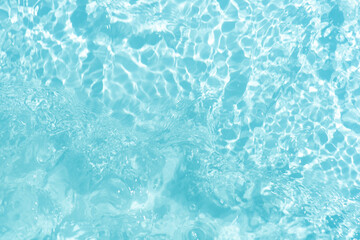 Blue water with ripples on the surface. Defocus blurred transparent blue colored clear calm water...