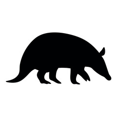 Silhouette of a nine banded armadillo walking with its distinctive armored body and long tail