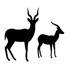 Silhouette of a large male antelope with impressive horns standing next to a smaller female antelope