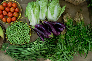 Vibrant assortment of fresh vegetables and herbs sourced from the market, perfect for nutritious meals.