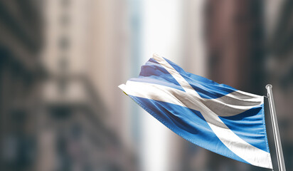 Scotland national flag waving on street. A beautiful with mast with blur buildings. Scotland...