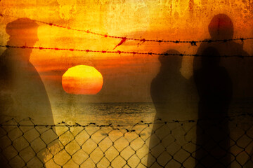 Refugee in Ukraine and Gaza and in the world showed as shadows on a wall with barbed wire