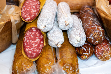 A variety of sausages at a street food market. Selective focus.