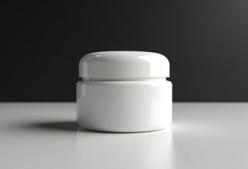 White cosmetic jar on dark background
