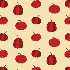 Seamless autumn pattern with red pumpkins on beige background for seasonal design and holiday decoration