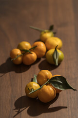 Fresh tangerines on wood table