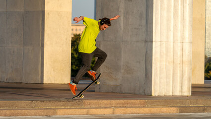 Skateboarder riding a skateboard and doing tricks