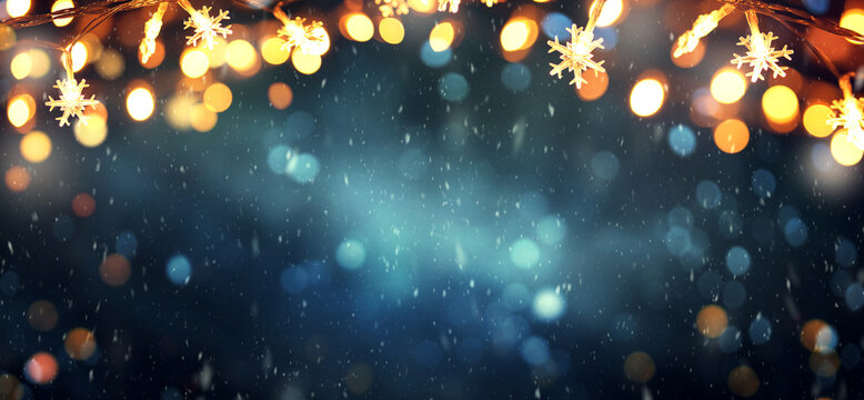 Christmas background with snowflakes lights and falling snow, winter holiday and New Year celebration theme with copy space