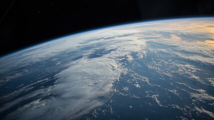 A stunning view of Earth from space, clouds over the vast blue ocean and the curvature of the planet against a starry backdrop.