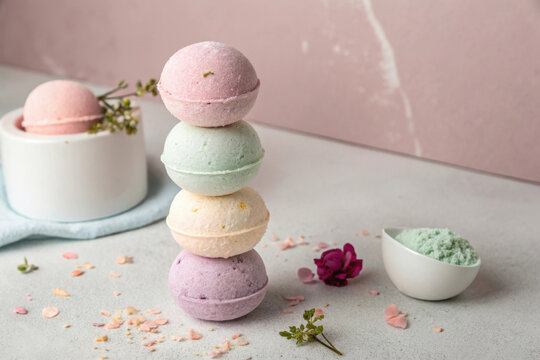 Stack of colorful bath bombs with floral and spa elements