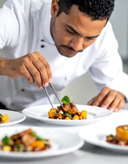 Chef meticulously plating a gourmet dish
