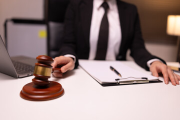 Female lawyer in office, Corporate lawyer at workspace, Attorney with legal books and gavel,