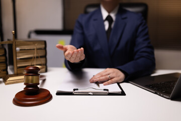 Lawyer businesswoman working diligently with signature document in a modern office, Signing...