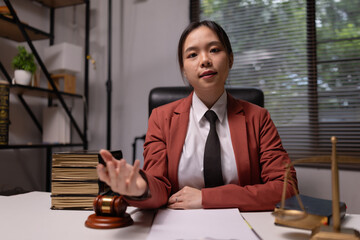 Female lawyer in office, Corporate lawyer at workspace, Attorney with legal books and gavel,